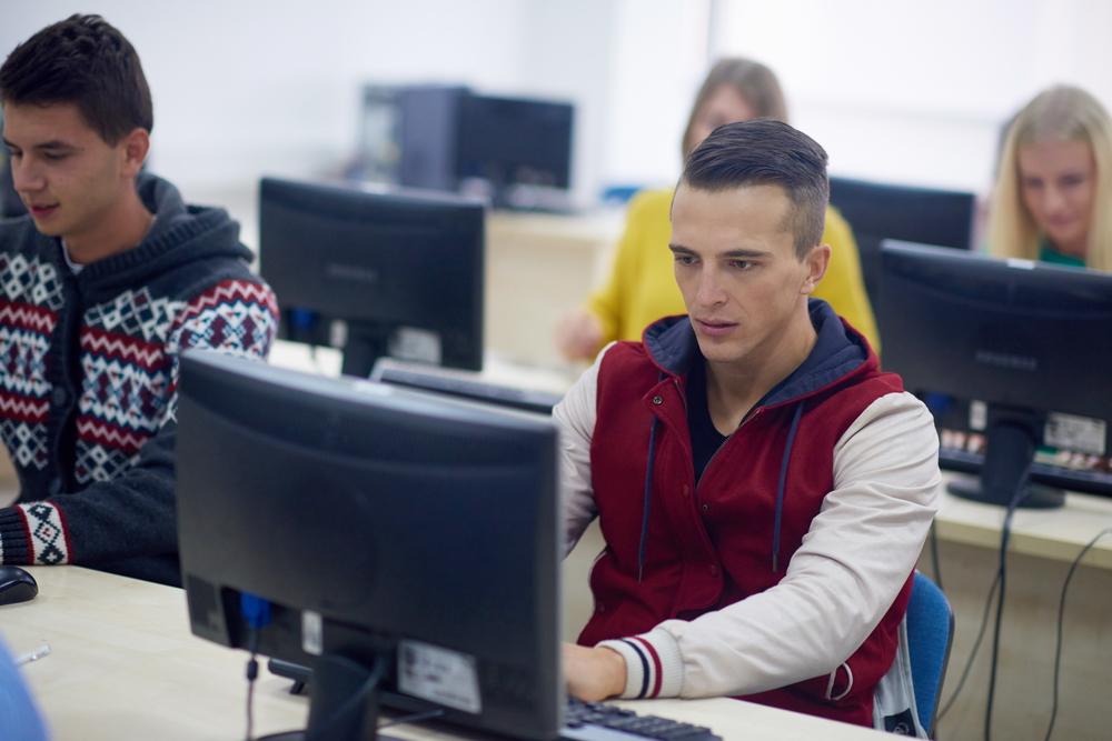 technology students group in computer lab classroom